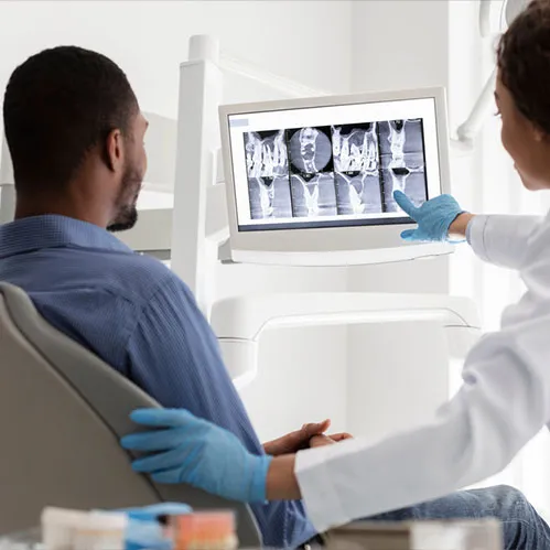 Dentist explaining to patient