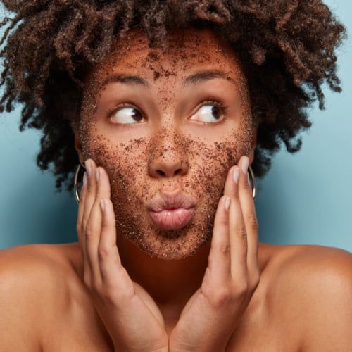 Women applying Exfoliation cream