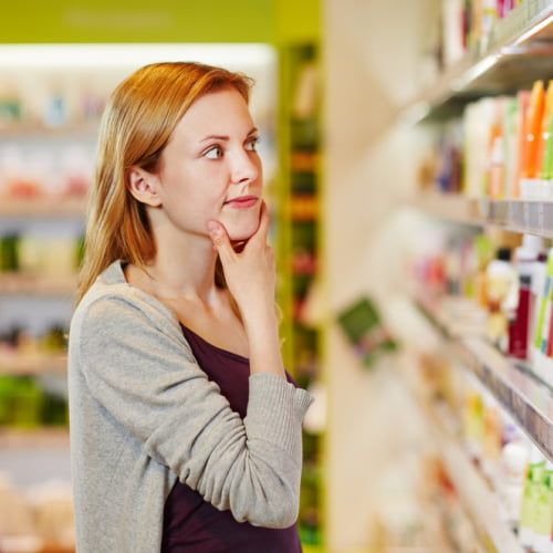 Women Checking makeup on shelf