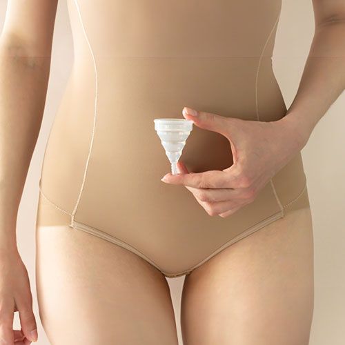 Women holding menstrual cup